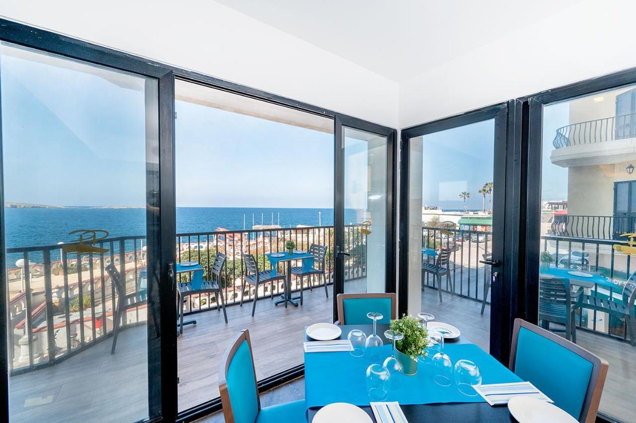 Islet Promenade Seafront Apartment With Large Corner Terrace By Getawaysmalta St. Paul's Bay Bagian luar foto